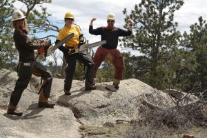 Jim showing our leaders how to pose with chainsaws